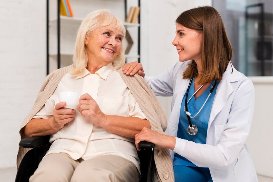 source: freepik.com Smiley old woman talking to caregiver