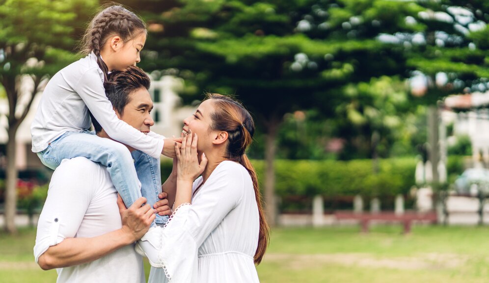 Portrait of happy family at the park
